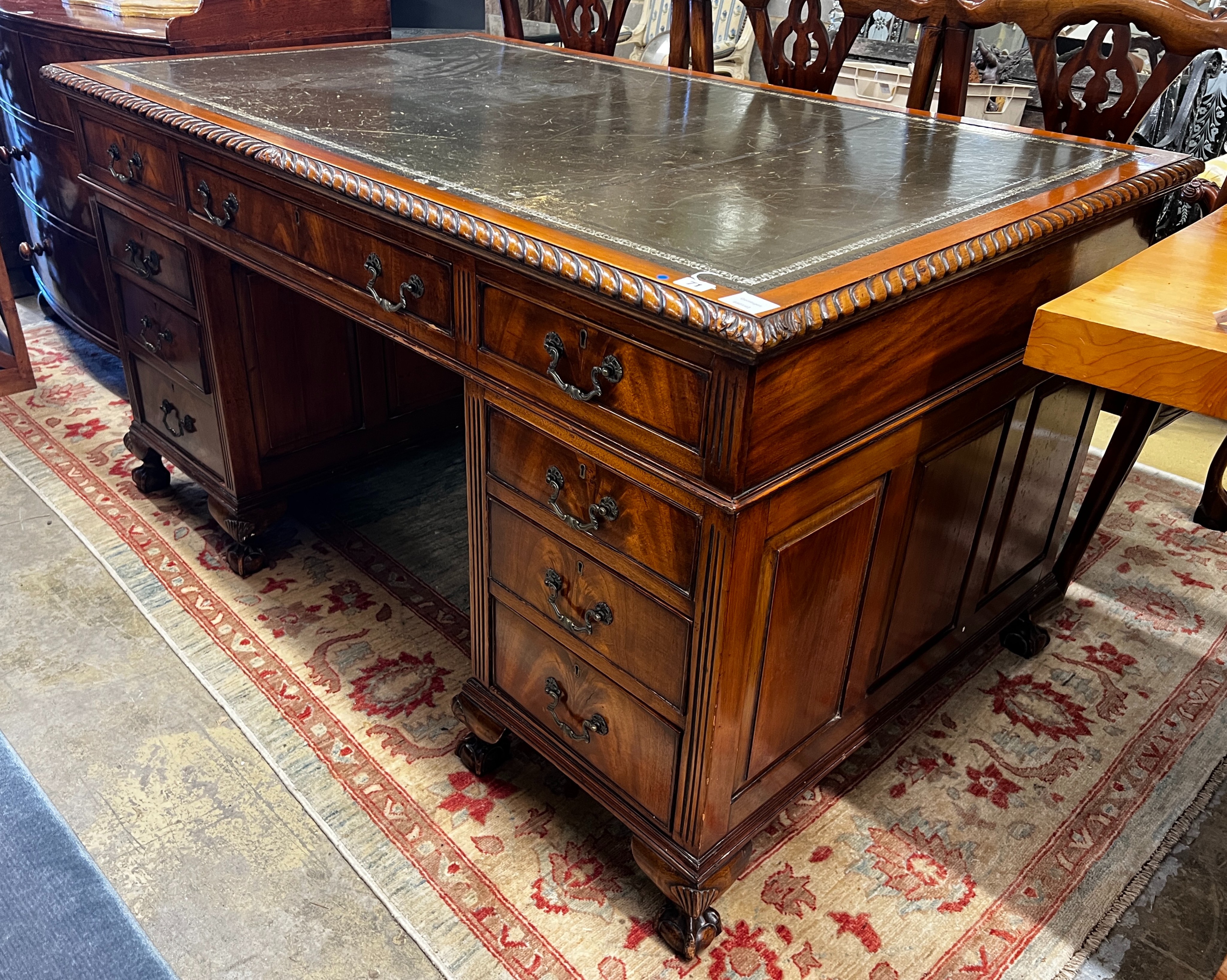 An early 20th century George III style mahogany pedestal desk, length 152cm, depth 91cm, height 81cm